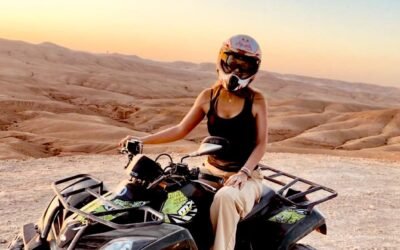 A rider enjoying an adventurous quad biking experience on the rugged trails of Marrakech, surrounded by breathtaking desert scenery. Sunset quad biking