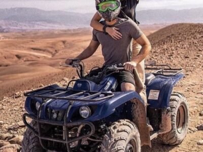 A couple riding quad bikes together in the Agafay Desert near Marrakech.