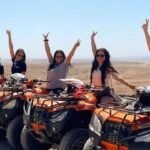 Group of people quad biking together in the Agafay Desert near Marrakech.