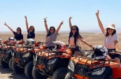 Group of people quad biking together in the Agafay Desert near Marrakech.