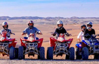 Group of people quad biking together in the Agafay Desert near Marrakech.