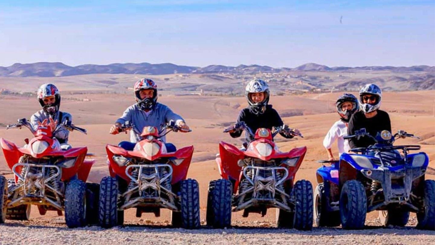 Group of people quad biking together in the Agafay Desert near Marrakech.