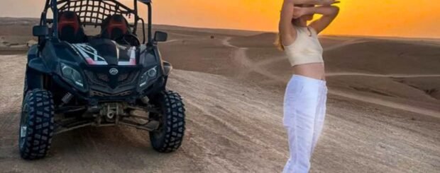 Woman enjoying a sunset buggy adventure in the Agafay Desert near Marrakech