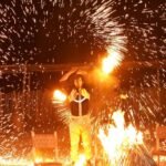 Fire show performance during a desert dinner in the Agafay Desert near Marrakech.