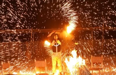Fire show performance during a desert dinner in the Agafay Desert near Marrakech.