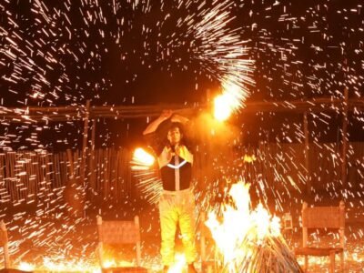 Fire show performance during a desert dinner in the Agafay Desert near Marrakech.