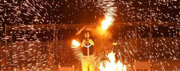 Fire show performance during a desert dinner in the Agafay Desert near Marrakech.