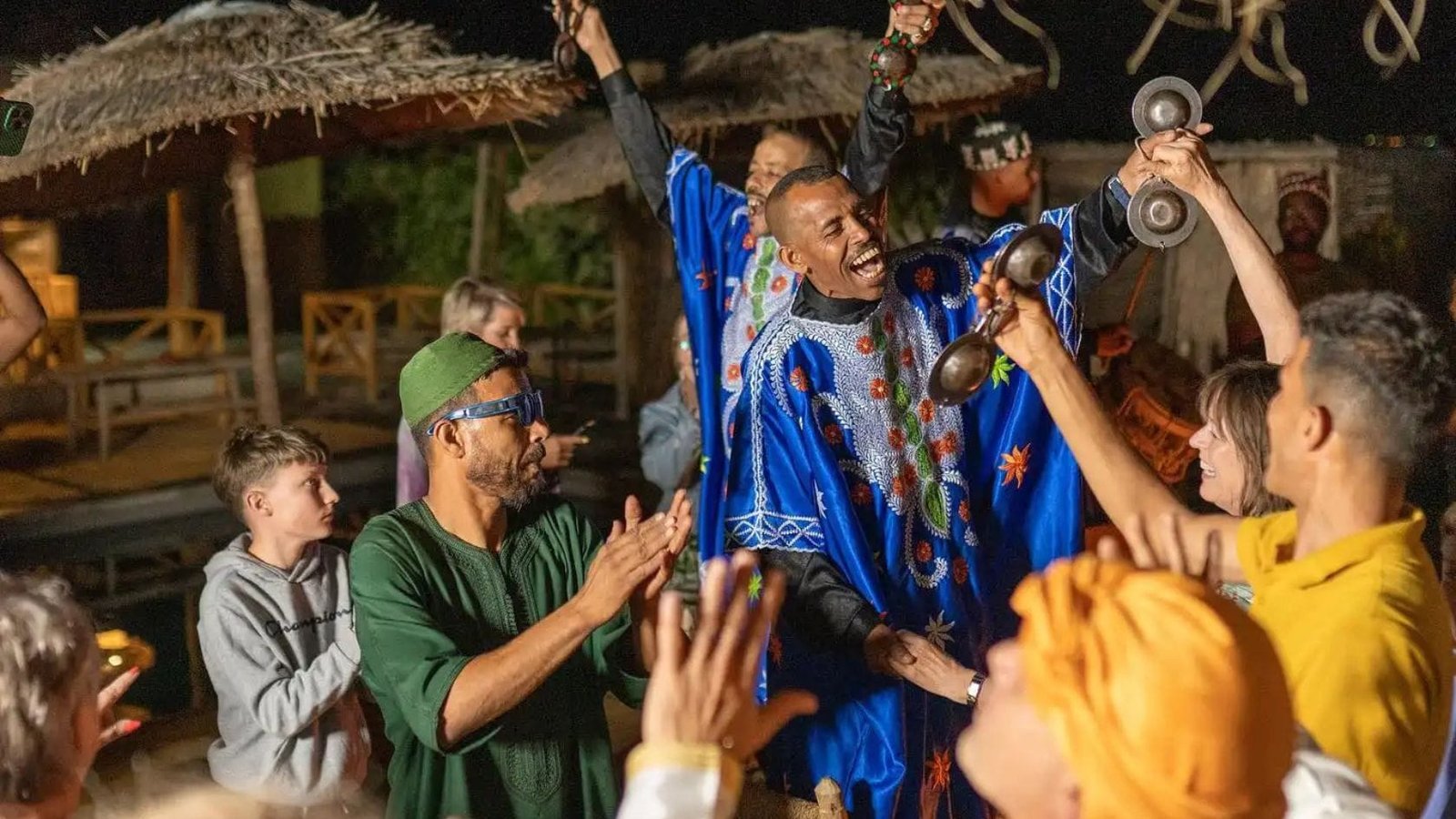 Traditional Gnawa music show during a desert dinner in the Agafay Desert near Marrakech.